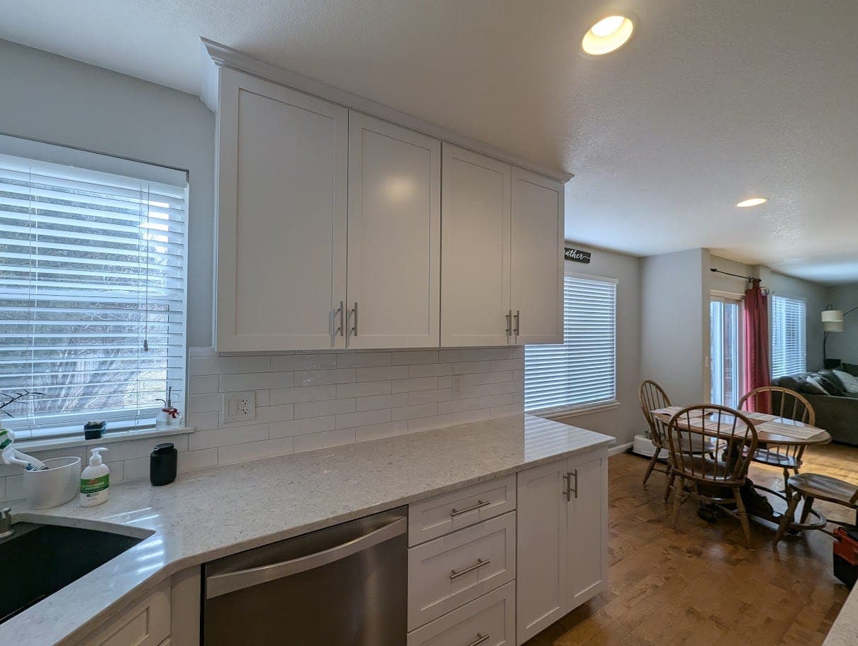 Kitchen ceiling repaired, textured, and painted after a toilet leak, Fort Collins.